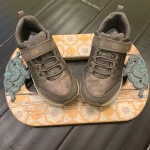 Girls Geox light brown patent leather sneakers.